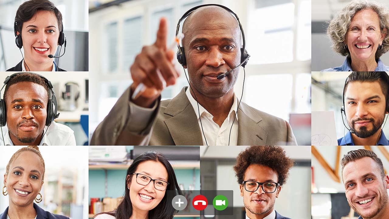 Global learner Cohorts 1280x720px_ African american male with head set on talking to a multi racial group of students online