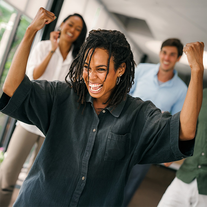 Home pages mobile 800x800px African amercian female with arms raised up with excitement and joy