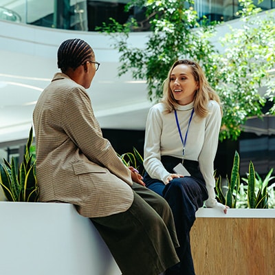Colleagues having a one-to-one workplace learning conversation